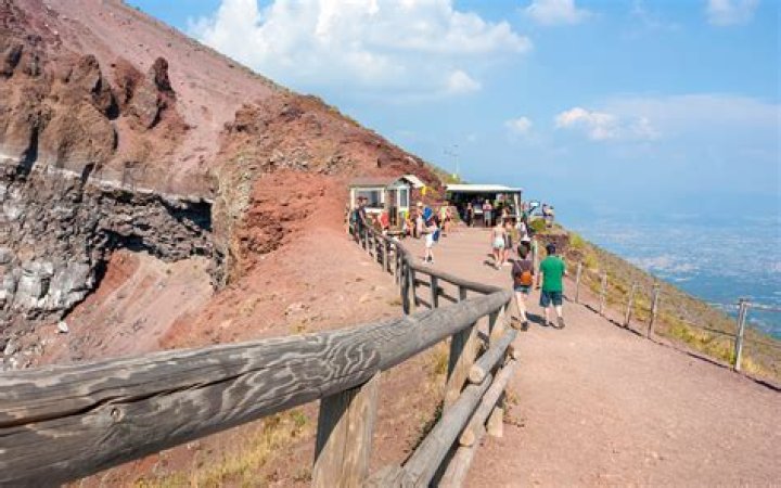 A tourist visiting Mount Vesuvius dropped his phone. Then he fell into
